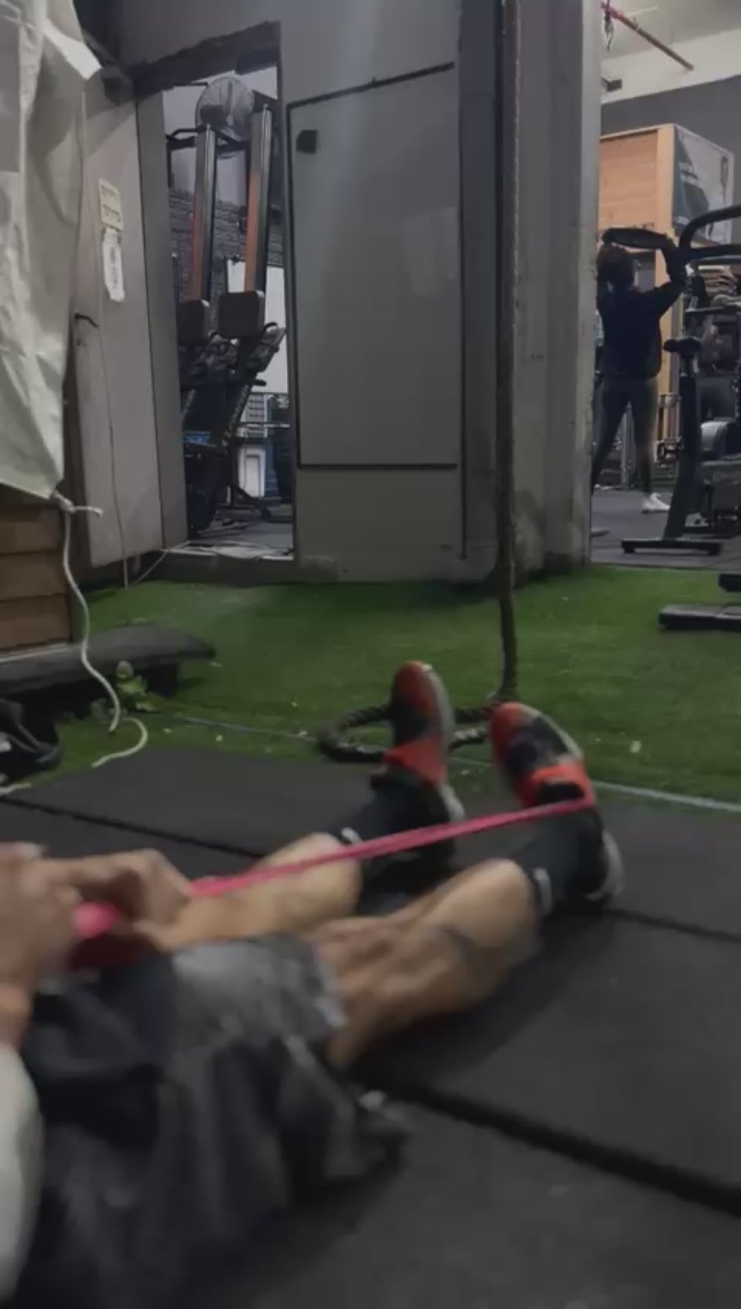 Load video: Sit with your legs extended and the band looped around your foot, anchored in front. Slowly move your foot in a controlled, circular motion to strengthen the ligaments.