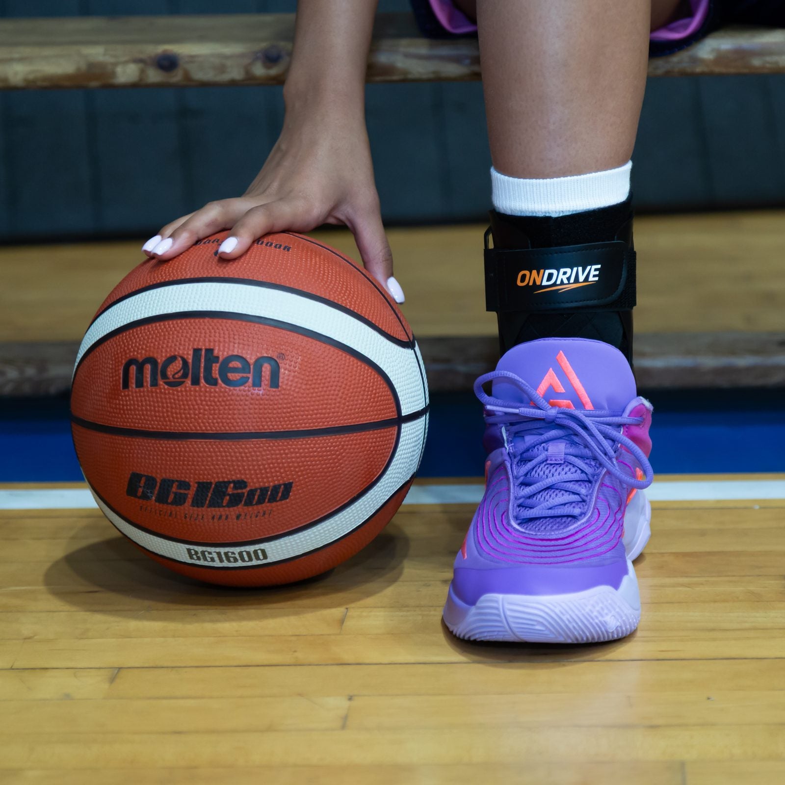 ONDRIVE brace courtside with basketball